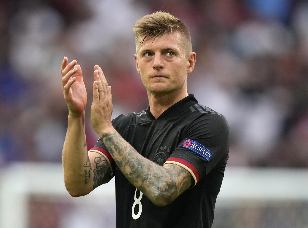 In this June 29, 2021 file photo Germany's Toni Kroos applauds the fans at the end of the Euro 2020 soccer championship round of 16 match between England and Germany at Wembley stadium in London, Germany midfielder Toni Kroos has announced his international retirement after 106 appearances for the country. (AP Photo/Frank Augstein, file)
