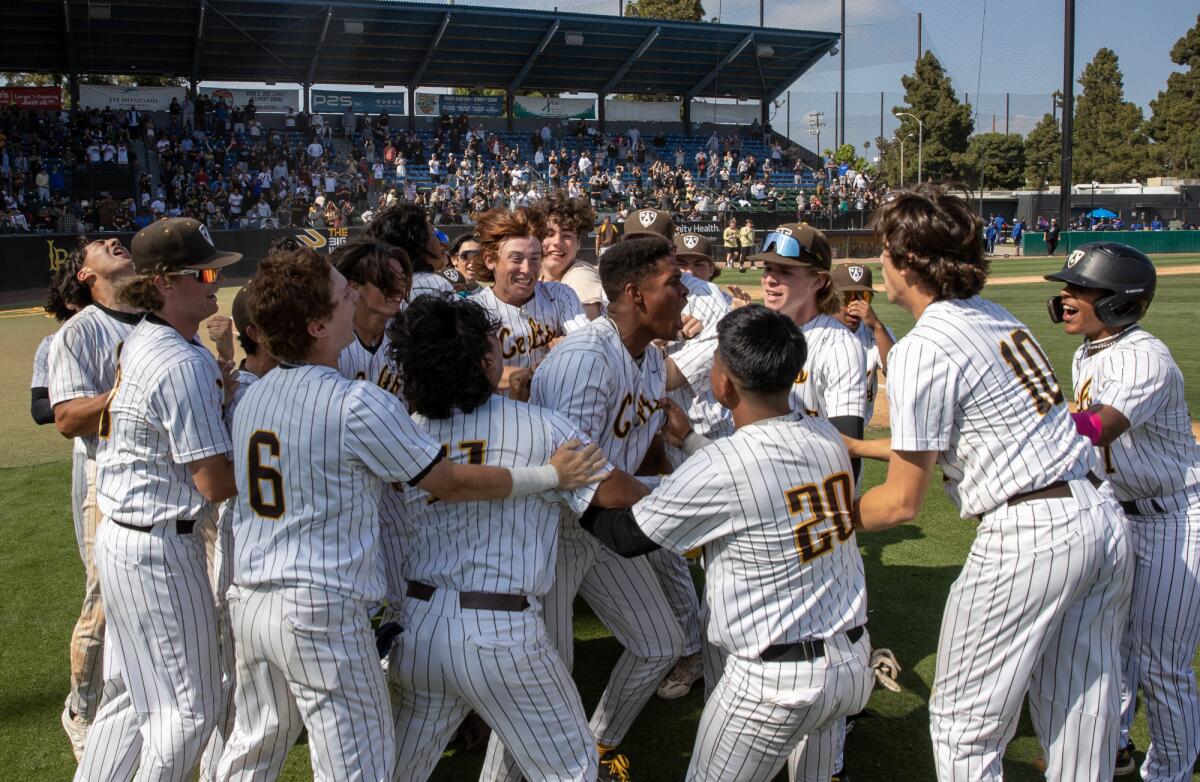 Encino Crespi players rejoice after their 6-5 walk-off win over West Covina South Hills in the Division 2 final May 20, 2023.