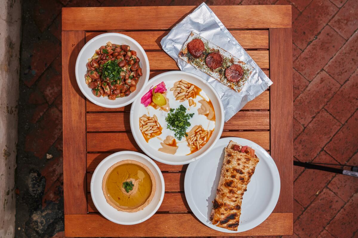 Fatteh, center, and other Syrian-inspired dishes at weekend pop-up Nawal.