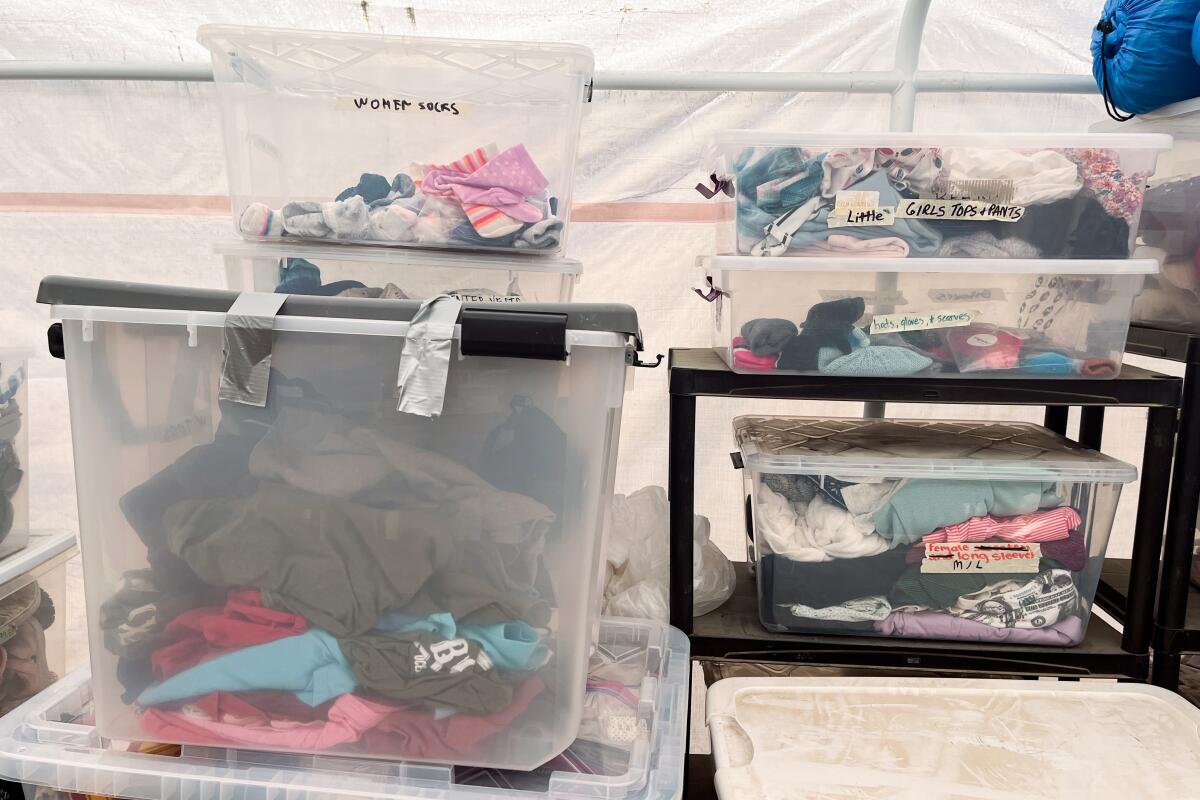 Supplies for migrants at a field camp run by the American Friends Service Committee that is set up next to the border fence in San Diego.