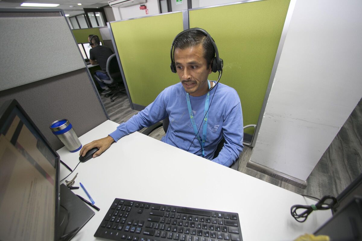David Garcia, 35, worked from his desk at the "Redial" call center in Tijuana, Baja California Mexico on Wednesday, September 25, 2019.