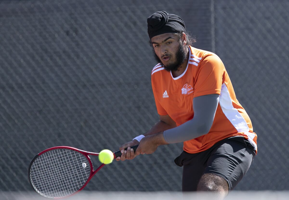 Huntington Beach's Amrit Grewal returns a ball during a Wave League match against Edison on Thursday.