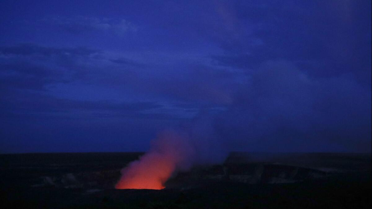 Kilauea's summit crater glows red in Volcanoes National Park, Hawaii on May 9.