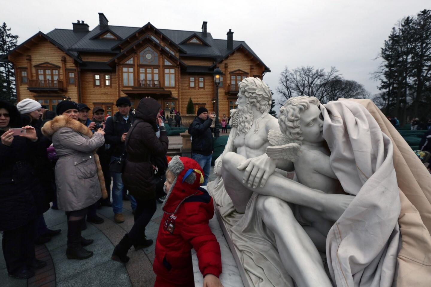 Thousands of Ukrainians flocked to President Viktor Yanukovich's abandoned residence near Kiev.