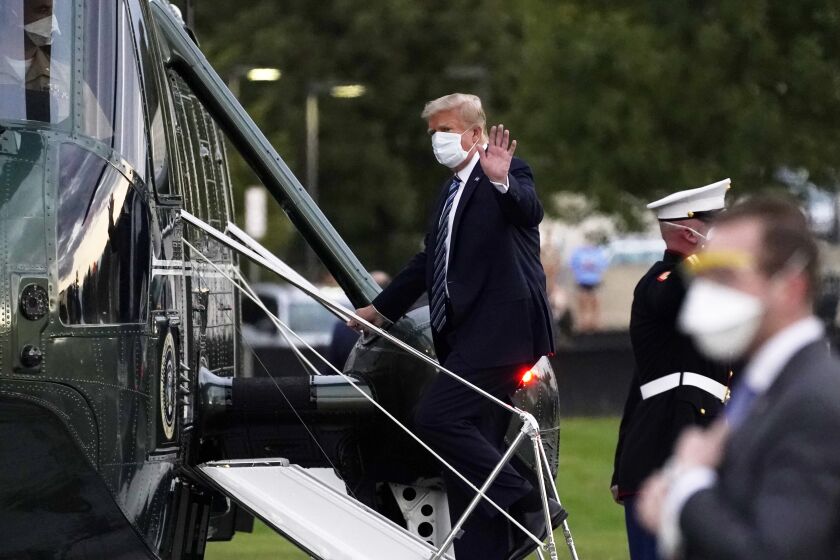 President Donald Trump boards Marine One to return to the White House