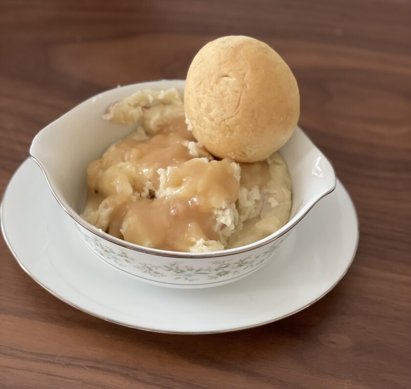 Mashed potatoes and a roll