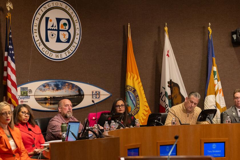 Huntington Beach, CA - January 16: Huntington Beach city council members from left: council member Natalie Moser, council member Rhonda Bolton, council member Pat Burns, Mayor Grace Van Der Mark, council member Tony Strickland, council member Casey McKeon, listen to speakers from Protect Huntington Beach, a group of concerned residents of Huntington Beach who want to increase residents' awareness of proposed charter changes during a Huntington Beach City Council meeting in Huntington Beach City Hall Tuesday, Jan. 16, 2024. (Allen J. Schaben / Los Angeles Times)