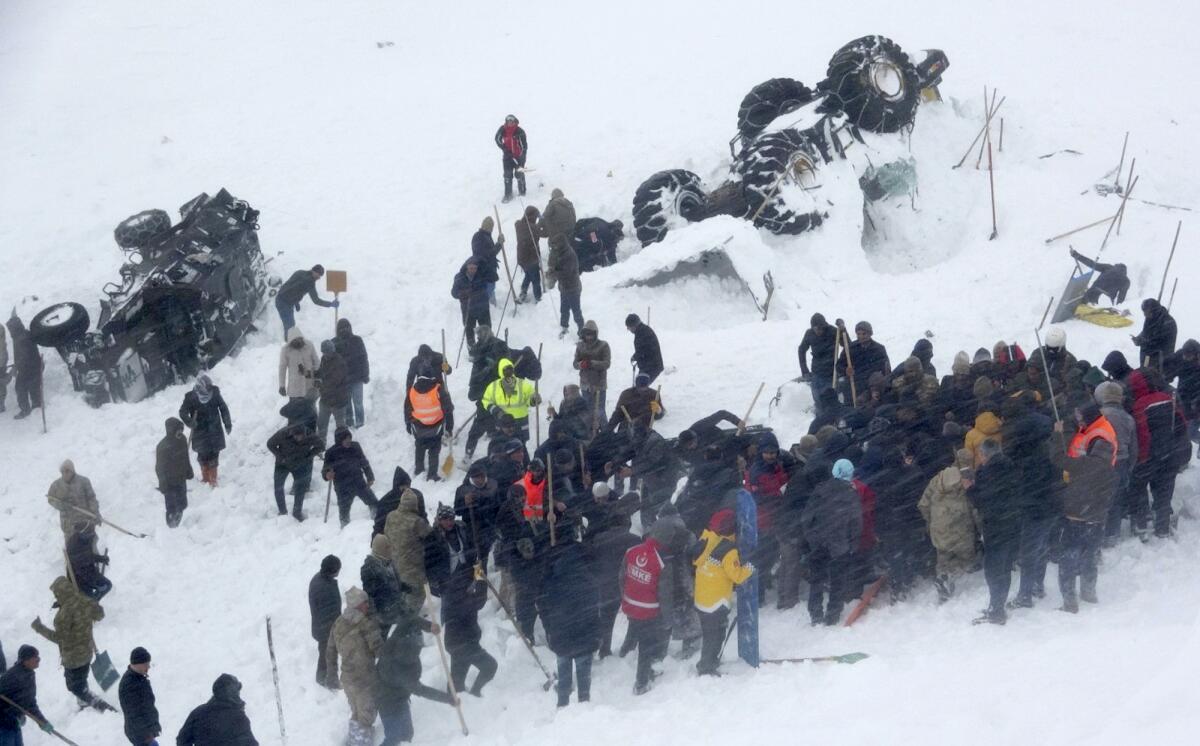 Emergency service members at the scene of an avalanche near the town of Bahcesaray, Turkey, on Wednesday.