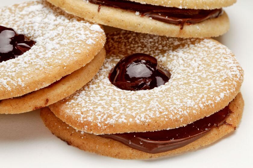 Chocolate raspberry linzer cookies are perfect for the holidays.