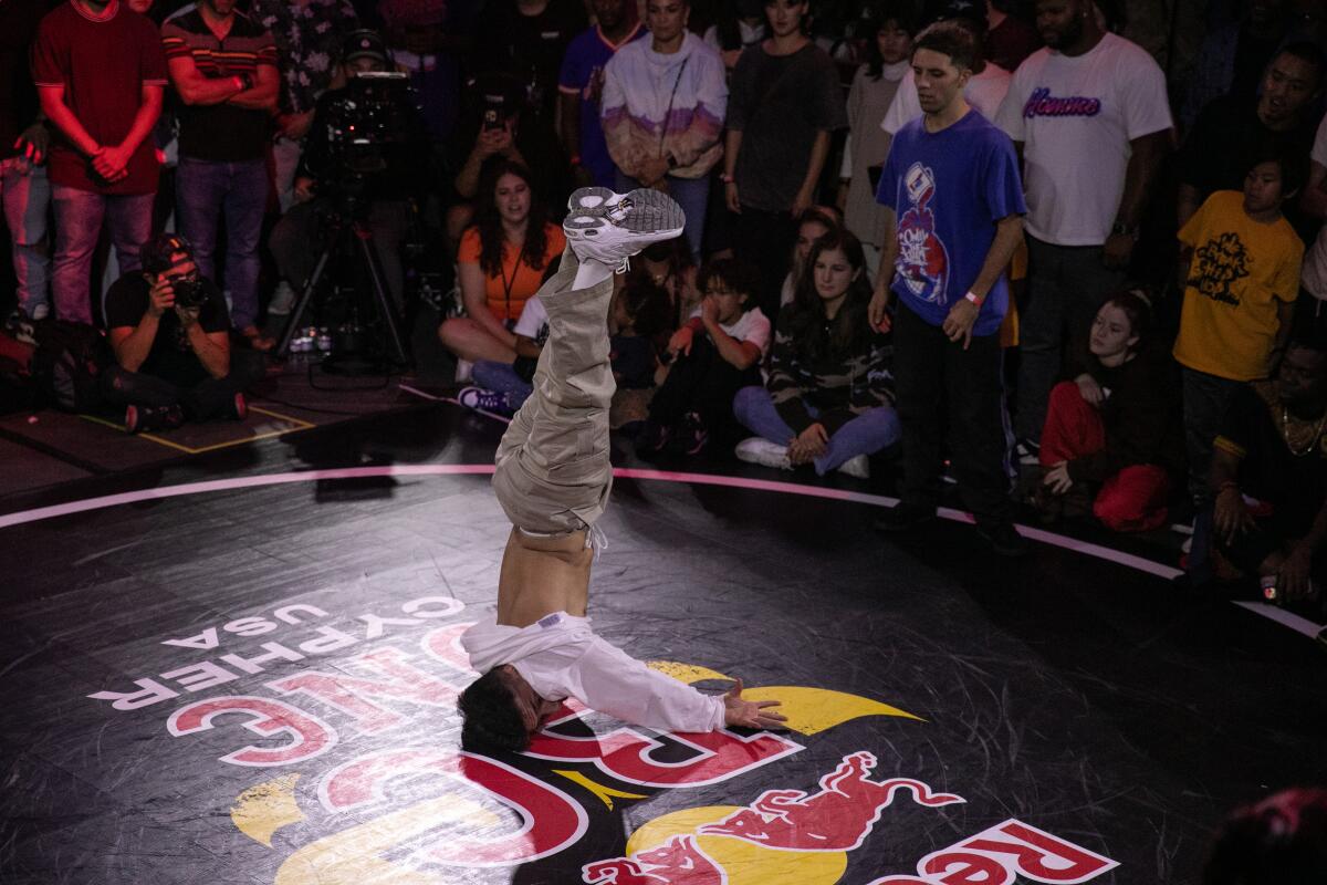 A contestant competes on his head.