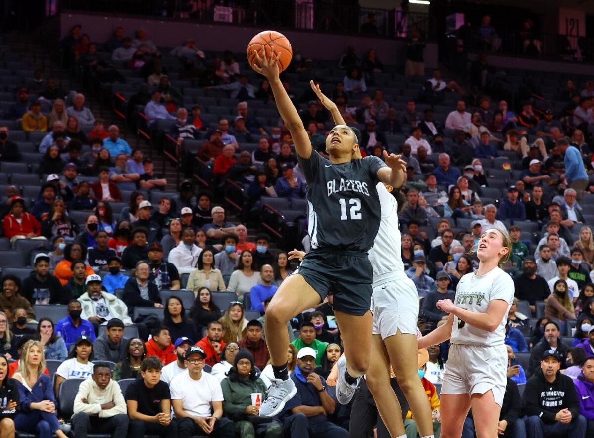 Sierra Canyon High star Juju Watkins rises for a layup against Archbishop Mitty.