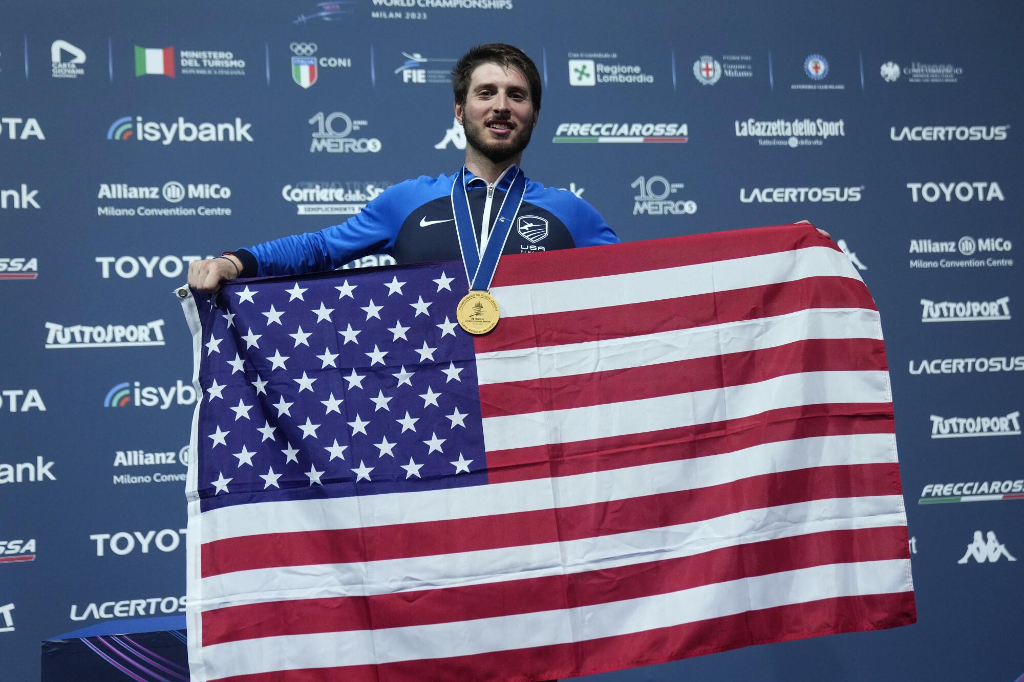Eli Dershwitz celebrates with an American flag.