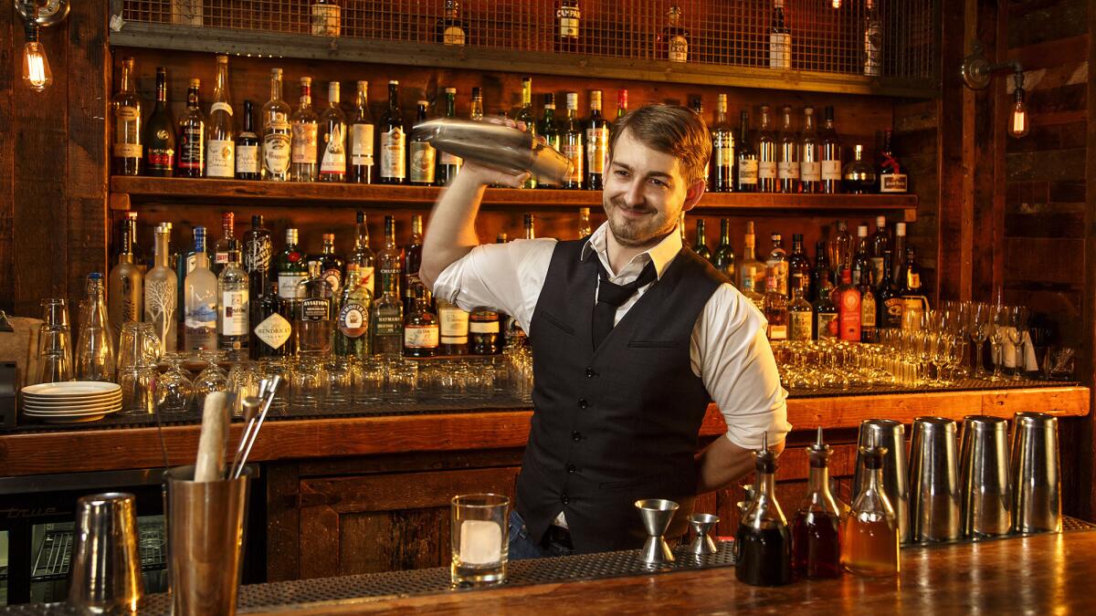 A bartender mixes a Honey Badger at a Sherman Oaks spot.
