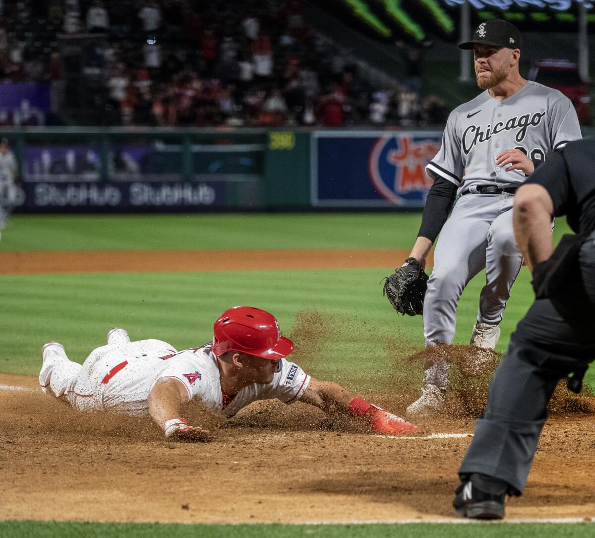 Angels center fielder Mike Trout scores the winning run on a wild pitch.