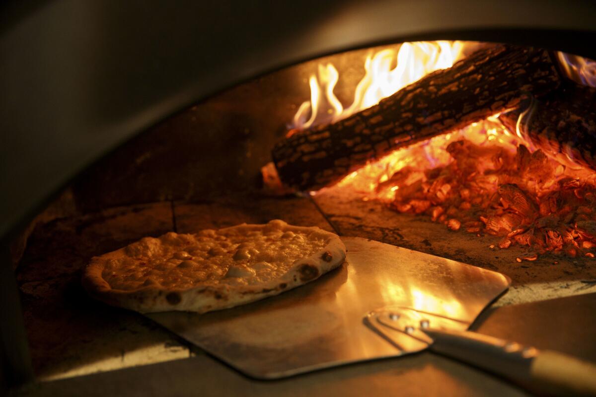 Pizza cooked in a wood fired oven from Pizzana.