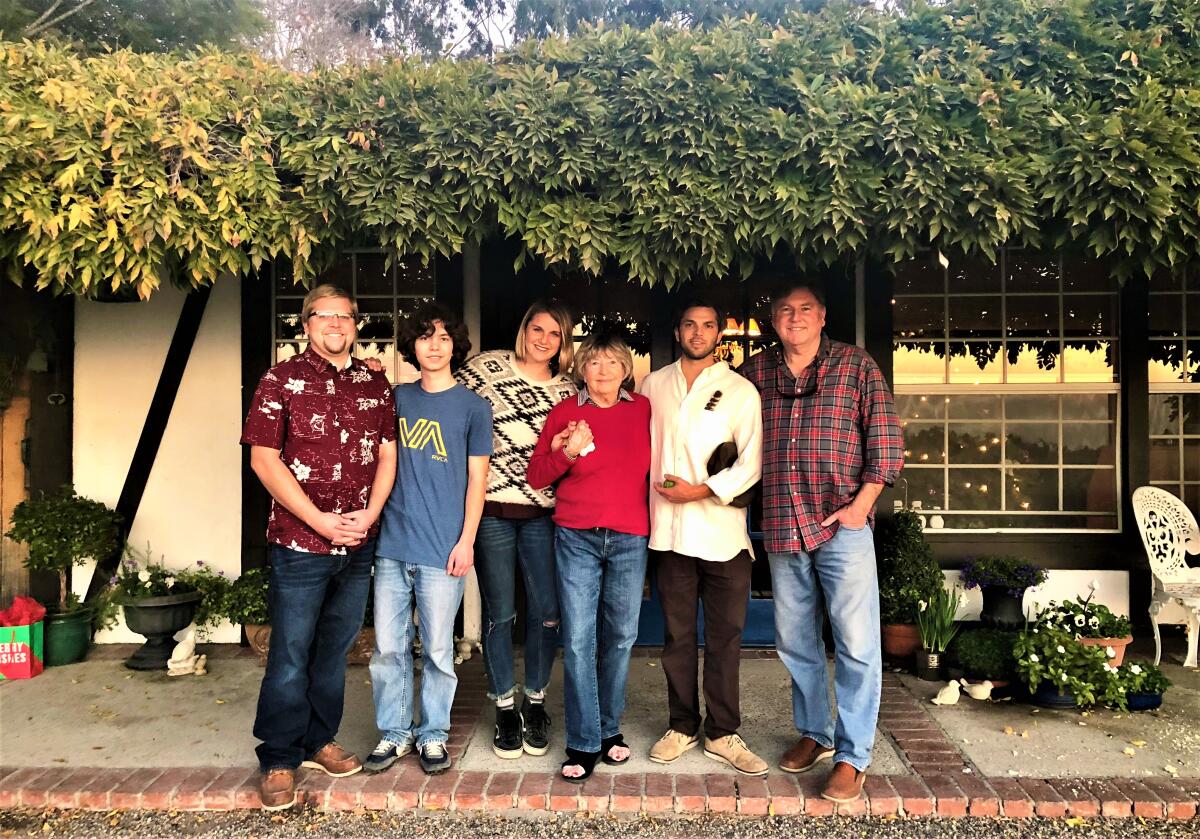 Pat Maurer, center, with her grandchildren and son Craig, right, at the Fallbrook home they named "Lob Hill" in 2018.