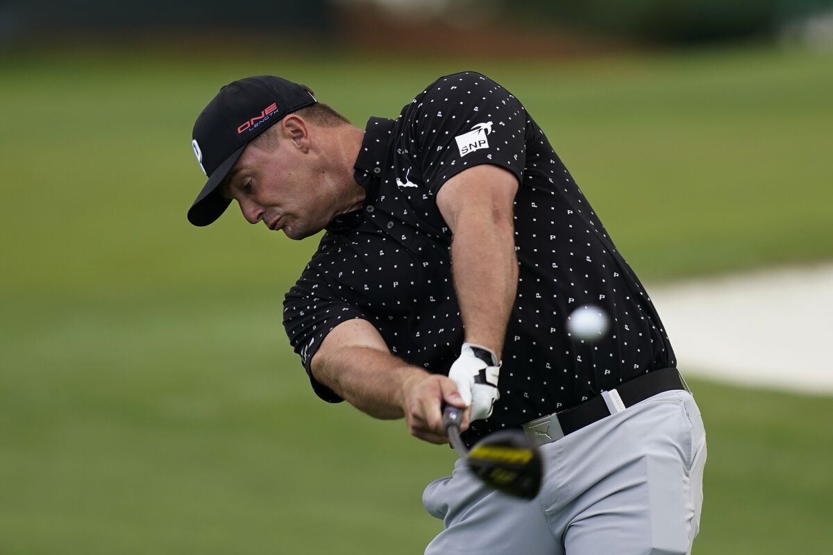 Bryson DeChambeau tees off on the third hole during a practice round for the Masters golf tournament Tuesday, Nov. 10, 2020, in Augusta, Ga. (AP Photo/David J. Phillip)