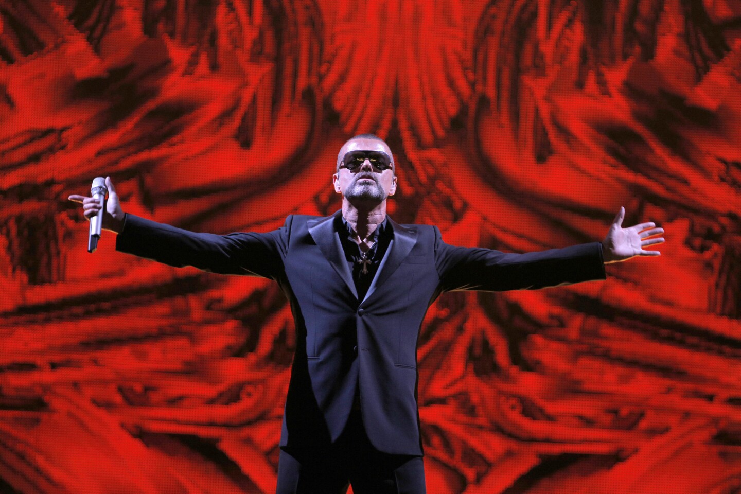 British singer George Michael performs at a concert in Paris in 2012 to raise money for an AIDS charity.