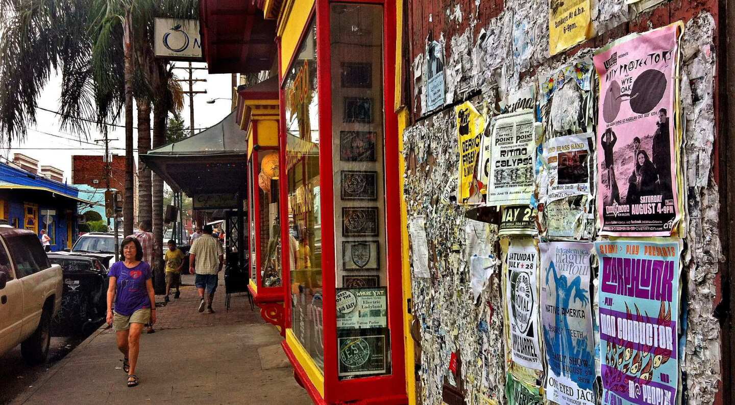 Remnants of years and years of fliers and band posters decorate a wall along Frenchmen Street in New Orleans.
