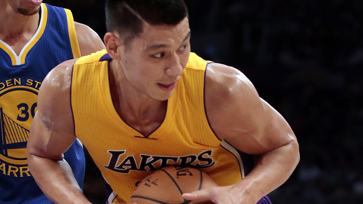 Lakers guard Jeremy Lin looks to pass during a preseason game against the Golden State Warriors on Oct. 9.