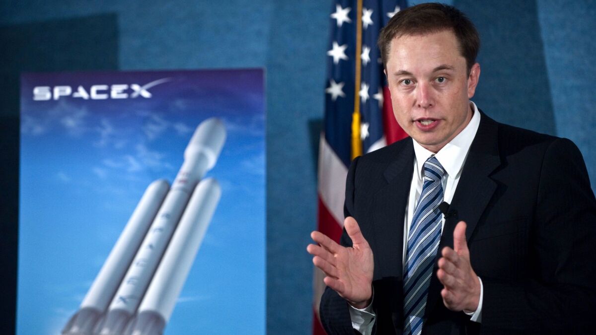 SpaceX CEO Elon Musk unveils the Falcon Heavy rocket at the National Press Club in Washington on April 5, 2011.