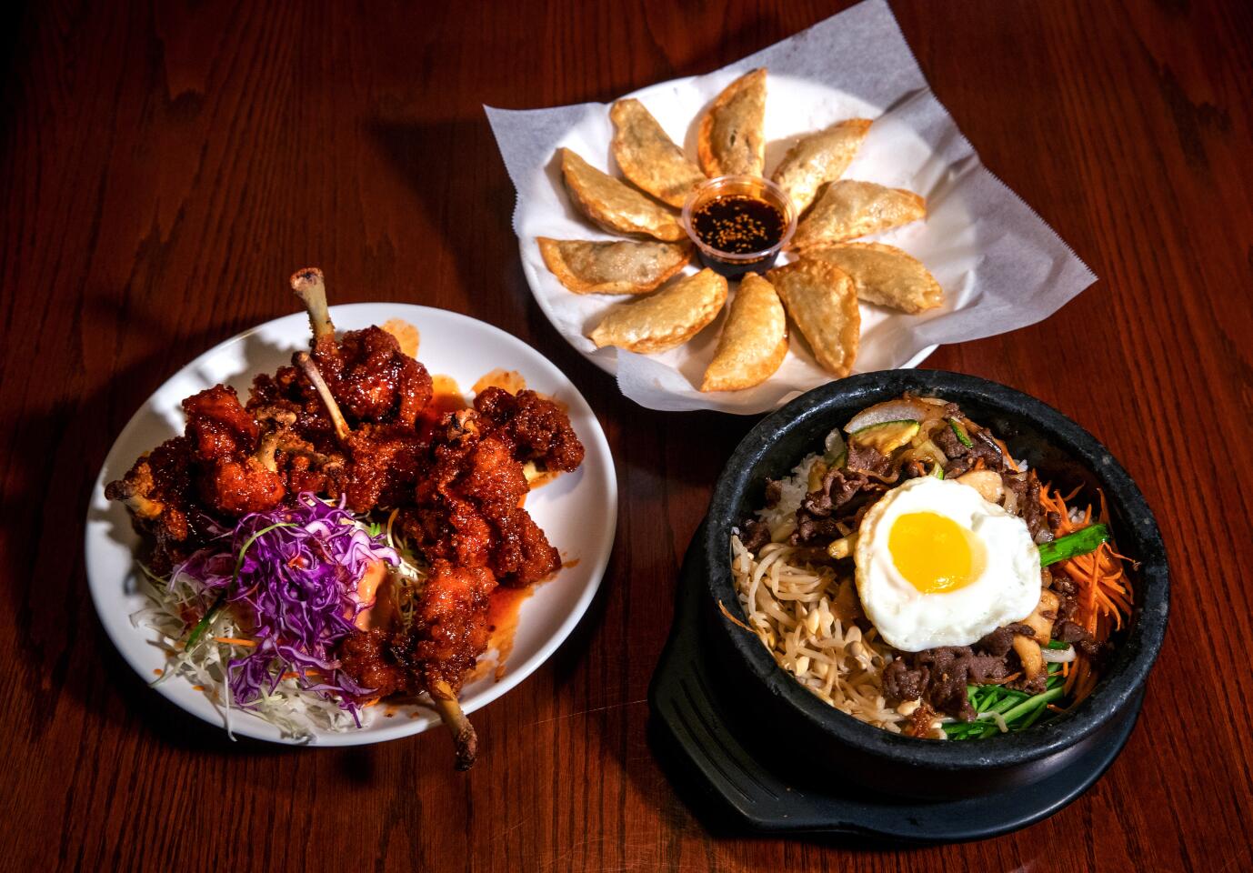 Spicy seasoned chicken wings, gyoza fried dumplings and bibimbap