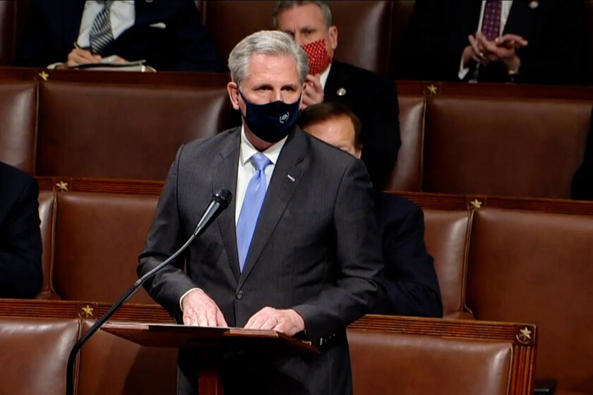 House Minority Leader Kevin McCarthy wears a mask in the House chamber. 
