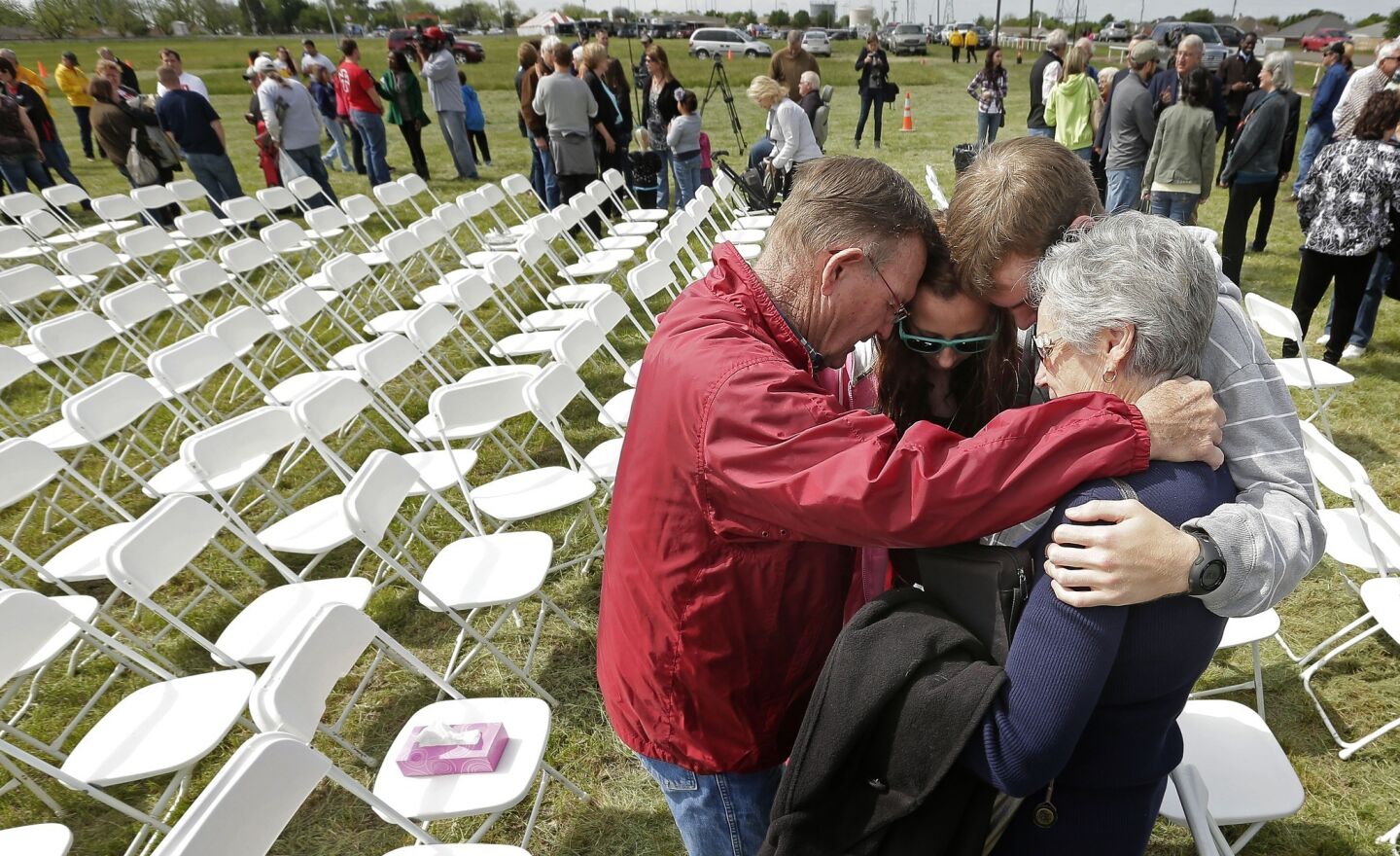 Churchgoers pray after a First Baptist Church service held in a field because the building was in the damage zone after a massive explosion at a fertilizer plant in West, Texas.