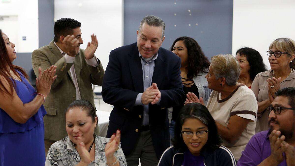 LOS ANGELES, CA-NOVEMBER 20, 2018: Alex Villanueva, center, is applauded for at a reception hosted by Citizens PAC and SEIU, groups that financially backed candidate Alex Villanueva for L.A. County Sheriff. (Katie Falkenberg / Los Angeles Times)