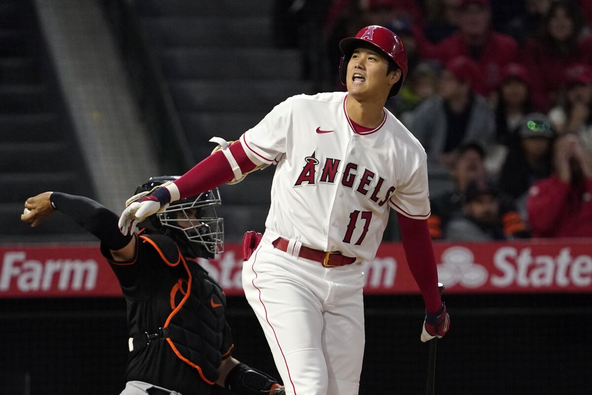 Angels batter Shohei Ohtani reacts after taking a strike during the fourth inning.