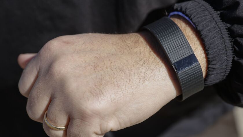 Six current and former Fitbit employees have been charged in a federal indictment. Above, a Fitbit fitness tracker.