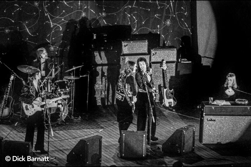 Paul McCartney and Wings perform at Hammersmith Odeon, London, in 1973. Mandatory credit: Dick Barnatt