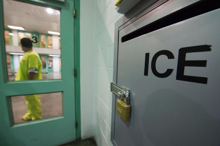 An immigration detainee stands near an US Immigration and Customs Enforcement (ICE) grievance box in the high security unit at the Theo Lacy Facility, a county jail which also houses immigration detainees arrested by the US Immigration and Customs Enforcement (ICE), March 14, 2017 in Orange, California, about 32 miles (52km) southeast of Los Angeles. US President Donald Trumps first budget provides more than USD 4.5 billion in new spending to fight illegal immigration by adding immigration and border enforcement agents, prosecutors and judges, as well as building a wall on the border with Mexico. / AFP PHOTO / Robyn Beck (Photo credit should read ROBYN BECK/AFP via Getty Images)