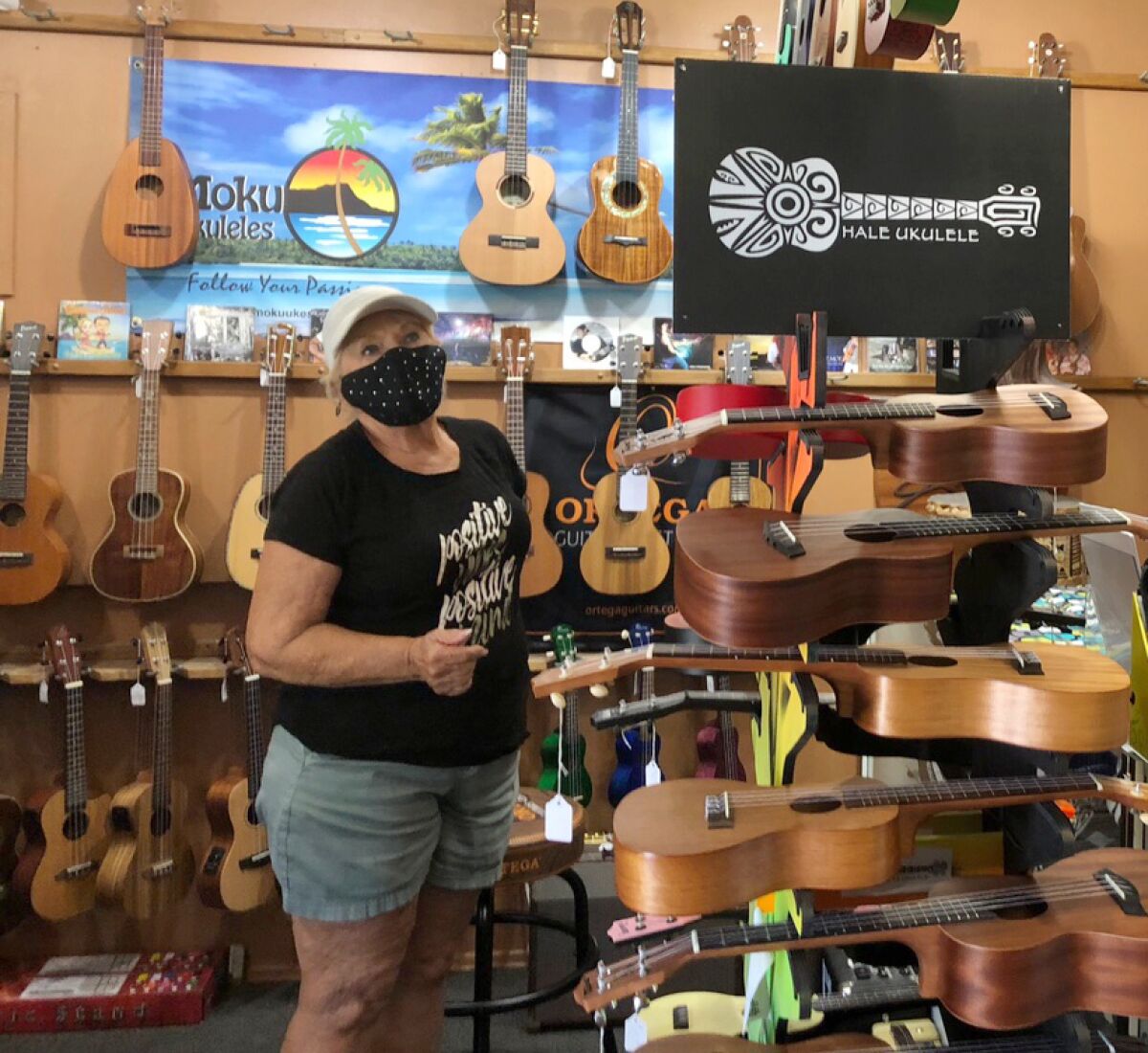 Rita Eastman, one of The Ukuladies performers, shops for a ukulele at Hale Ukulele store in San Diego.