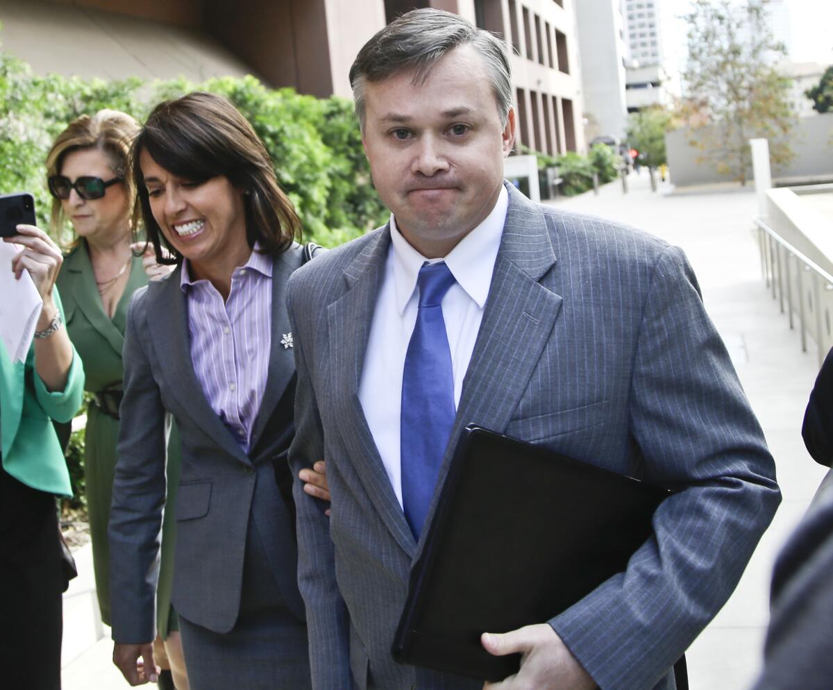 John Beliveau, accompanied by attorney Gretchen von Helms, arrives at the federal courthouse to plead guilty to two counts of bribery.
