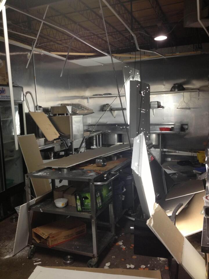 A collapsed ceiling shows damage caused by the train derailment and explosion.