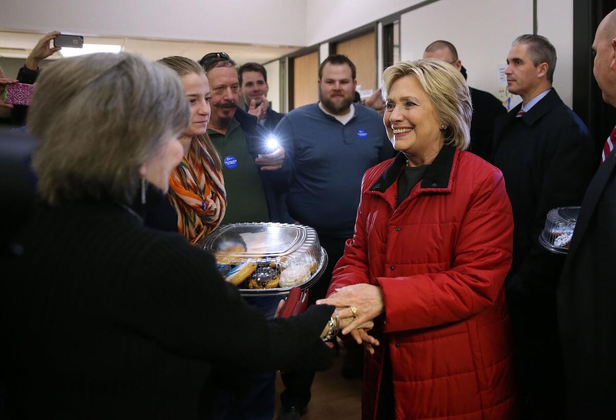 Hillary Clinton greets volunteers at a campaign office in Des Moines hours before the Iowa caucuses began.