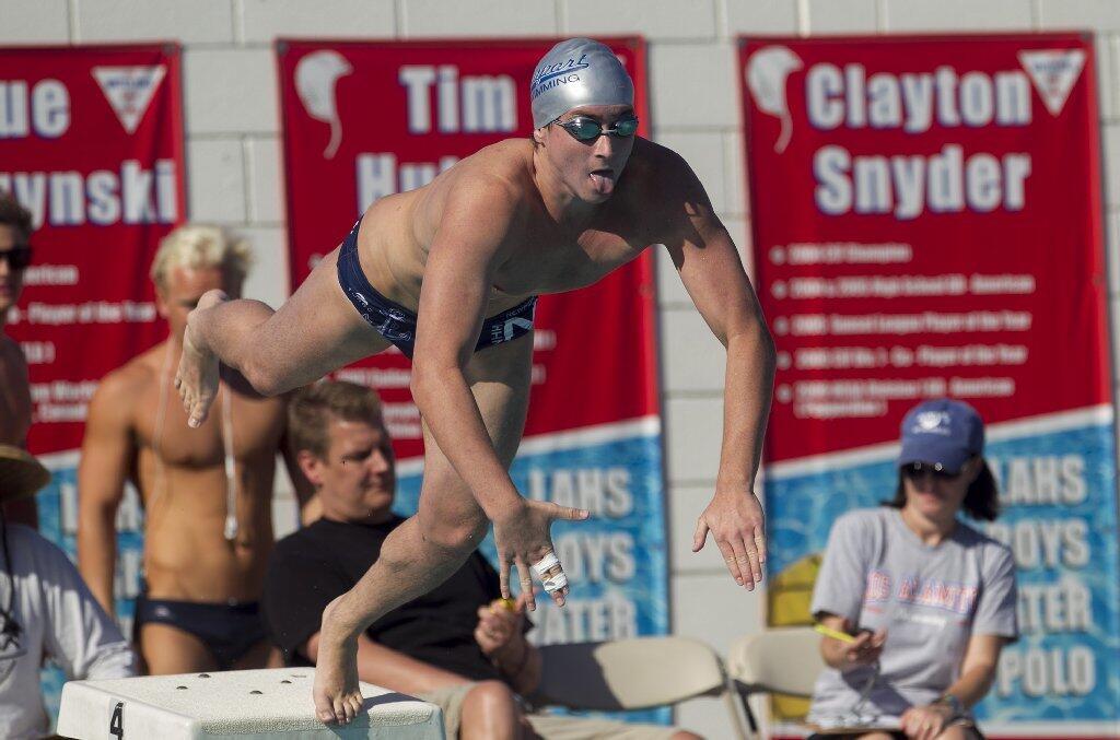 Newport Harbor High's Connor Turnbow-Lindenstadt starts the 200-yard individual medley during a Sunset League meet against Los Alamitos on Tuesday.