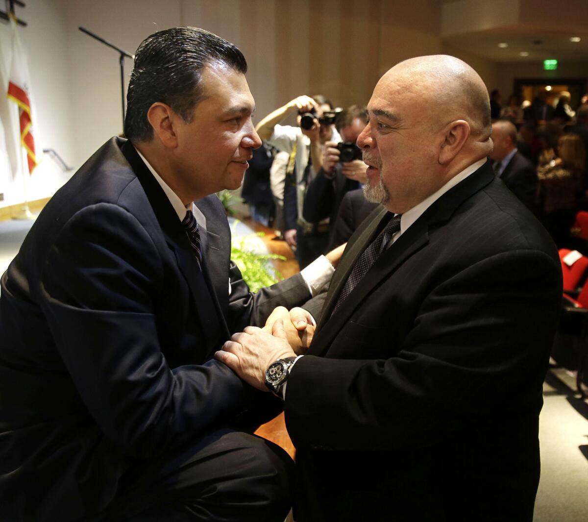 Alex Padilla, left, is congratulated by former Lt. Gov. Cruz Bustamante after he was sworn in as secretary of state in Sacramento last month.