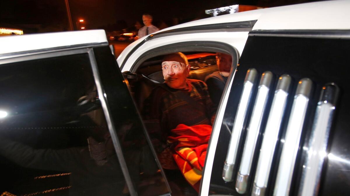 Navy veteran Carl Morgan looks out the limousine door during the Lights and Limos event courtesy of his hospice provider on Dec. 11 in Lake Forest.