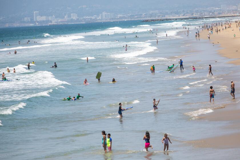 MANHATTAN BEACH, CA - JULY 02: Scenes from Manhattan Beach, CA, looking north, on Thursday, July 2, 2020, the day before Los Angeles County beaches close for the July 4th holiday, under order from California Gov. Gavin Newsom, in an effort to slow the spread of the coronavirus. (Jay L. Clendenin / Los Angeles Times)
