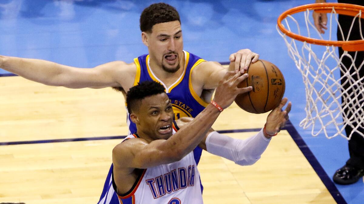 Golden State Warriors guard Klay Thompson rejects a shot by Oklahoma City Thunder guard Russell Westbrook in the fourth quarter of Game 6.