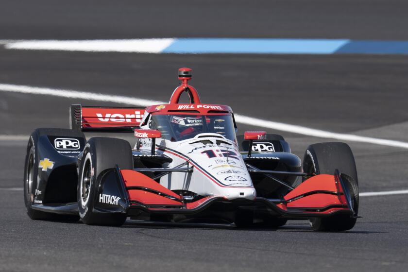 Will Power of Australia, drives into a turn during a practice session for the IndyCar Grand Prix auto race at Indianapolis Motor Speedway, Friday, May 10, 2024, in Indianapolis. (AP Photo/Darron Cummings)