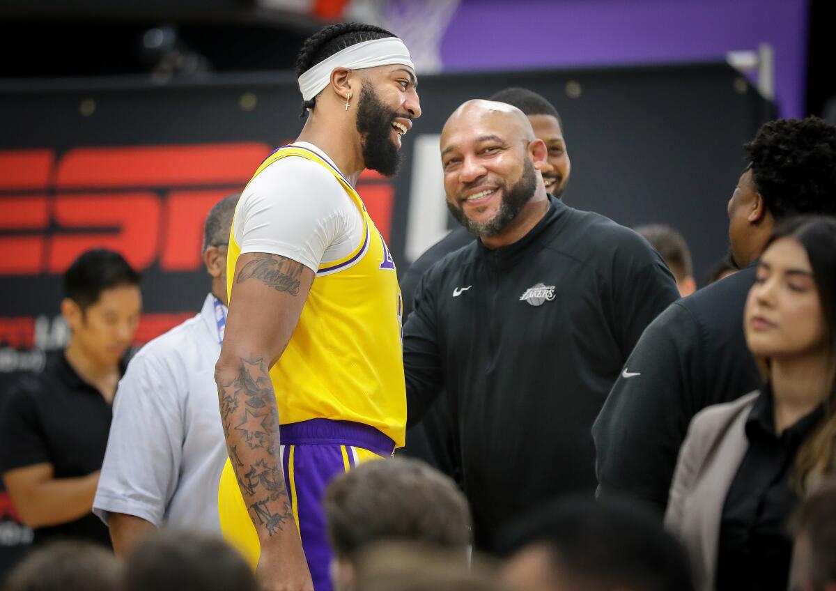 Lakers coach Darvin Ham chats with All-Star forward Anthony Davis during media day.