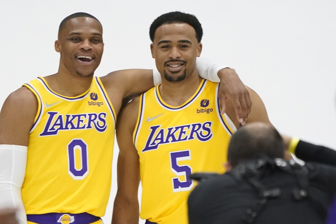 Los Angeles Lakers guard Russell Westbrook, left, takes a photo with Talen Horton-Tucker (5).