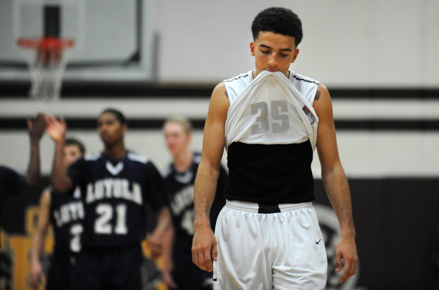 Crespi's London Perrantes walks off the court after the Celts lost to Loyola, 53-46, on Friday night in Encino.