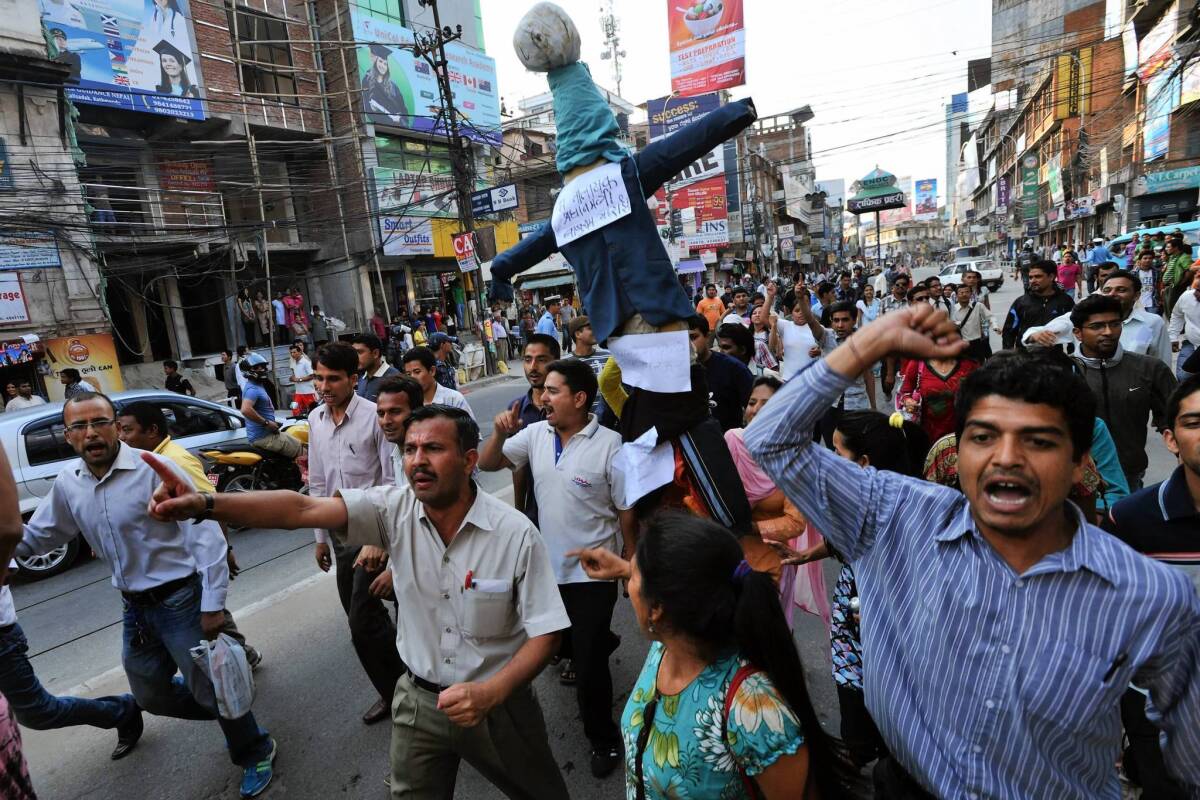 Nepalese demonstrate in Katmandu against ow-caretaker Prime Minister Baburam Bhattarai. The country’s leaders missed their deadline over the weekend to write a constitution.