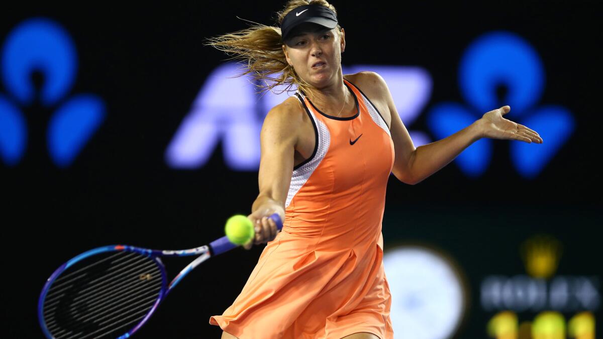 Maria Sharapova returns a shot against Lauren Davis during their third-round match Friday.