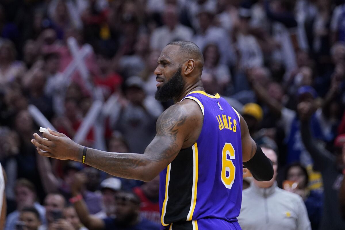 Lakers forward LeBron James reacts after being called for goaltending against the Pelicans.