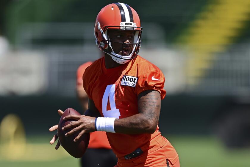 Cleveland Browns quarterback Deshaun Watson drops back to pass during an NFL football practice.